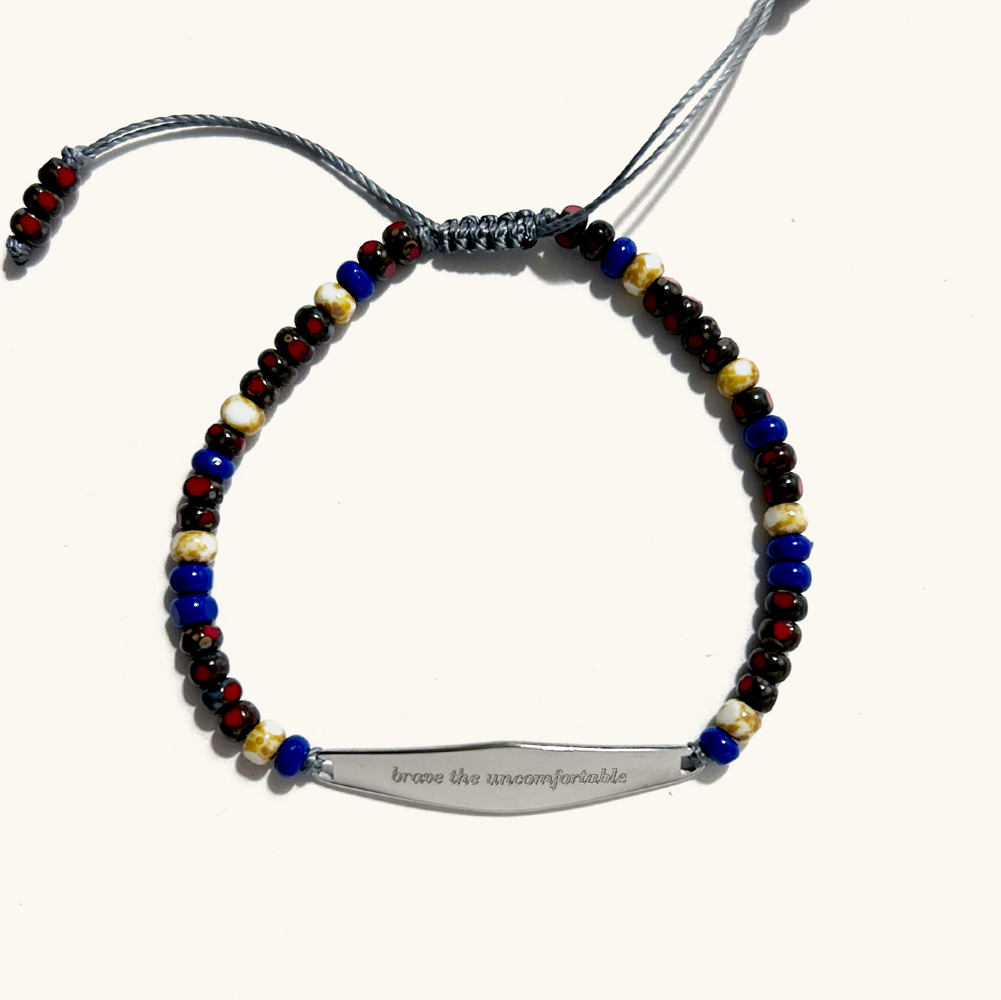 silver stainless steel anxiety mindfulness bracelet engraved with brave the uncomfortable.
