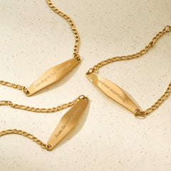 A close-up of three Presently bracelets designed for anxiety and OCD, each featuring an engraved phrase to support mental well-being.