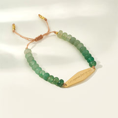 Gold Aventurine gemstone bracelet engraved with the phrase "I am separate from my mind," part of Presently's collection designed for managing OCD and anxiety.