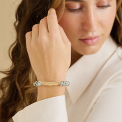 Model wearing a gold Tianshan jade gemstone bracelet engraved with "I let go of what I can't control."