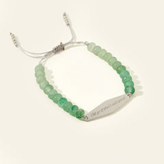 Silver Aventurine gemstone bracelet engraved with the phrase "I let go of what I can't control," part of Presently's collection designed for managing OCD and anxiety.