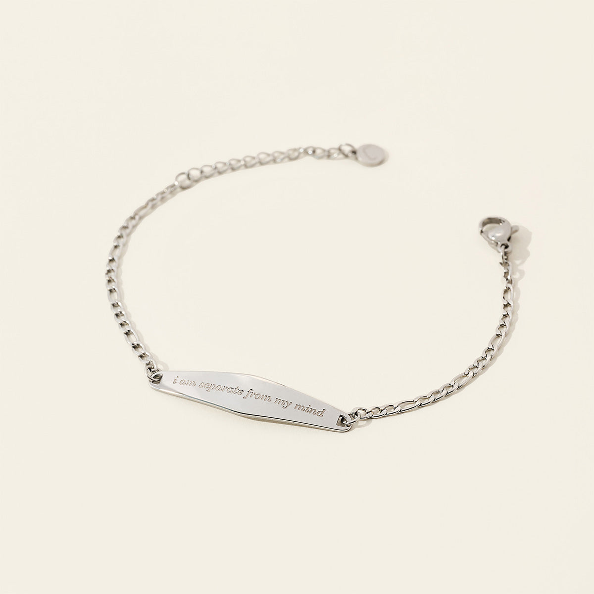 A silver Figaro Chain Bracelet featuring the engraved phrase 