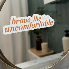 “Brave the Uncomfortable” therapy-inspired mirror decal displayed on a bathroom mirror