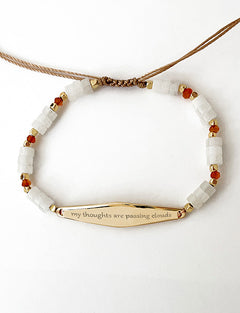 Gold Carnelian Agate Beaded Bracelet with the phrase "my thoughts are passing clouds"