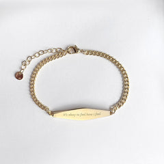 Gold Curb Chain Bracelet Engraved with the phrase "It's okay to feel how I feel"
