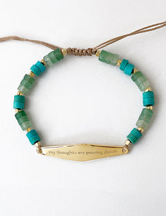 Gold Green Aventurine with the phrase "my thoughts are passing clouds"