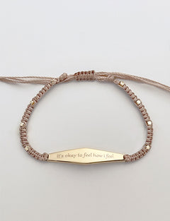Gold Macrame Bracelet with the phrase "its okay to feel how i feel"