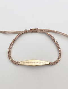 Gold Macrame Bracelet with the phrase "i am separate from my mind"