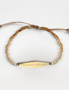 Gold Hessonite Gemstone Bracelet with the phrase "i let go of what i can't control"