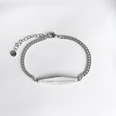 Silver Curb Chain Bracelet Engraved with the phrase "my thoughts are passing clouds"