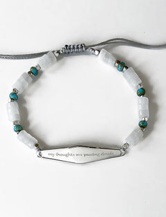 Silver Heishi Turquoise Bracelet with the phrase "my thoughts are passing clouds"