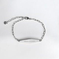 Silver Paper Clip Mindfulness Bracelet Engraved with the phrase "embrace uncertainty"
