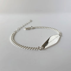 Silver Curb Chain Bracelet Engraved with the phrase "embrace uncertainty"