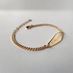 Gold Curb Chain Bracelet Engraved with the phrase "it's okay to feel how i feel"